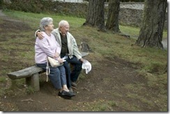old-happy-senior-couple-sitting-on-bench